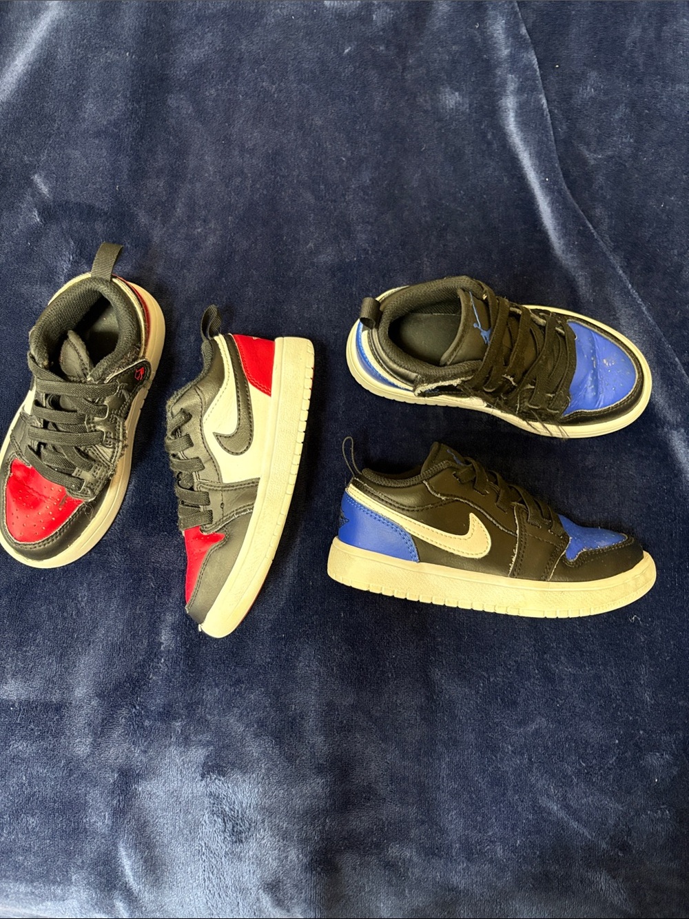 Nike Kids Low Top Sneakers in Black with Red and Blue Accents